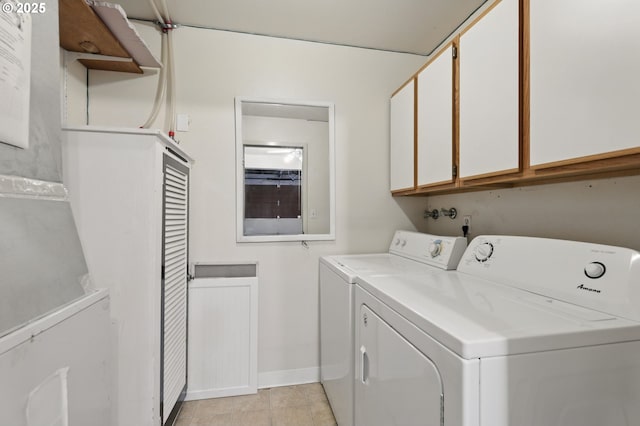 1571 NW Tanasbrook Ct, Beaverton, OR 97006 - laundry room with washing machine and dryer, cabinet space, baseboards, and light tile patterned floors