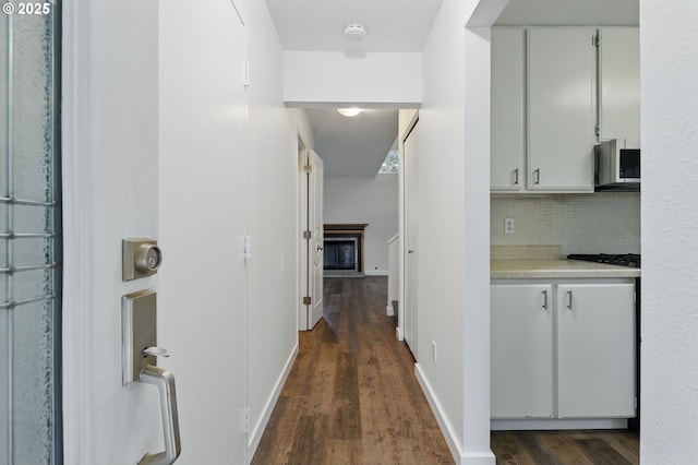 1571 NW Tanasbrook Ct, Beaverton, OR 97006 - hall with dark wood-style flooring and baseboards