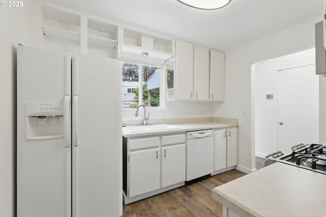 1571 NW Tanasbrook Ct, Beaverton, OR 97006 - kitchen with white appliances, a sink, light wood-style floors, white cabinets, and light countertops