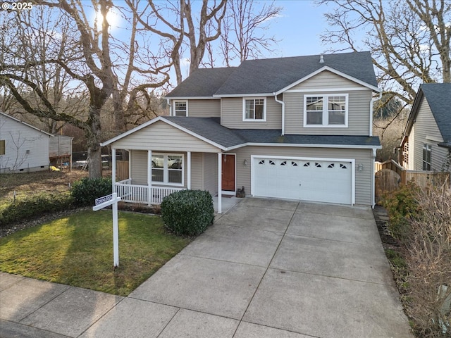 view of front property featuring a garage, a front yard, and covered porch