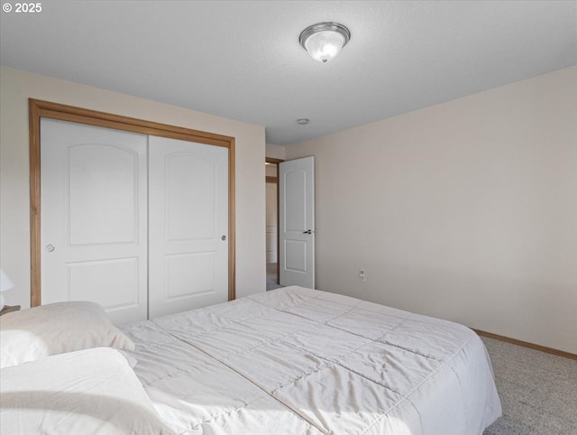 carpeted bedroom featuring a closet