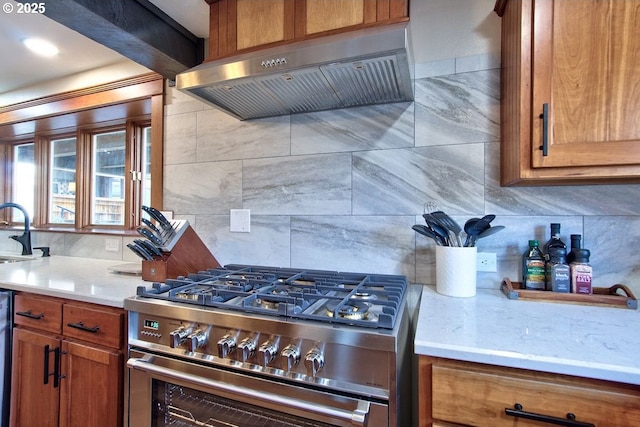 789 W Main St, Carlton, OR 97111 - kitchen featuring appliances with stainless steel finishes, exhaust hood, light countertops, brown cabinetry, and decorative backsplash