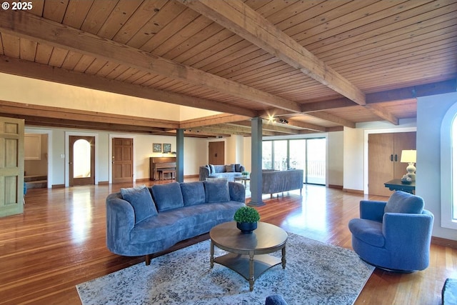789 W Main St, Carlton, OR 97111 - living room with wooden ceiling with exposed beams, wood finished floors, baseboards, and plenty of natural light