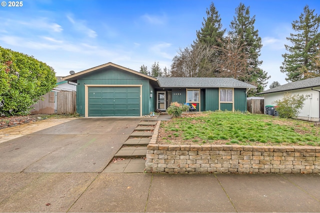 single story home featuring concrete driveway, an attached garage, and fence