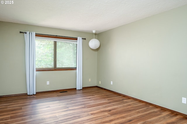 2011 SW 29th Dr, Gresham, OR 97080 - empty room featuring wood finished floors and a textured ceiling