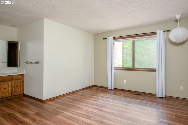 2011 SW 29th Dr, Gresham, OR 97080 - unfurnished bedroom featuring light wood-type flooring and a textured ceiling