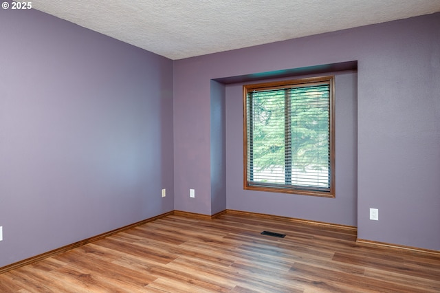 2011 SW 29th Dr, Gresham, OR 97080 - unfurnished room featuring light wood-style floors and a textured ceiling