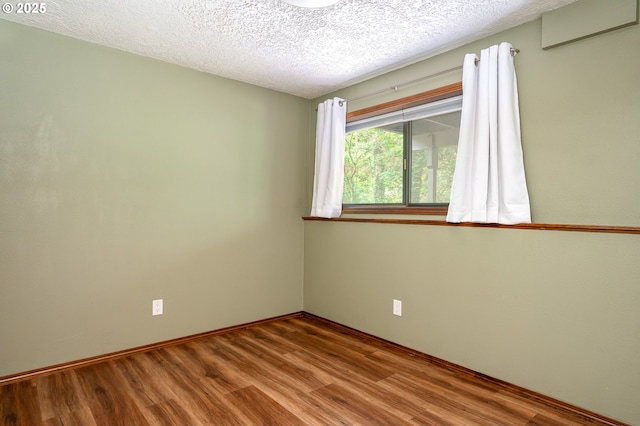 2011 SW 29th Dr, Gresham, OR 97080 - empty room with wood finished floors and a textured ceiling
