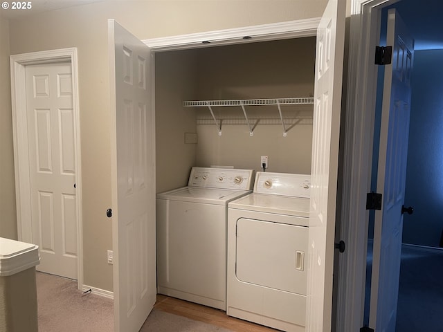 washroom with washer and dryer