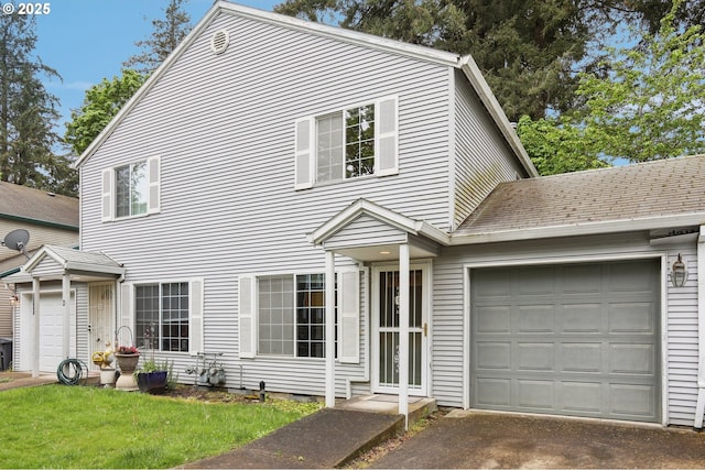 view of front of home featuring an attached garage and driveway
