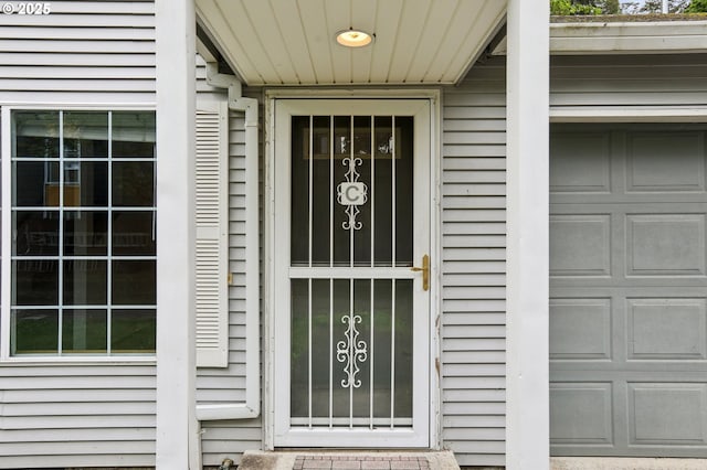 doorway to property featuring a garage