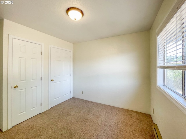 1911 Green Ave, Roseburg, OR 97471 - unfurnished bedroom featuring carpet flooring and a baseboard radiator