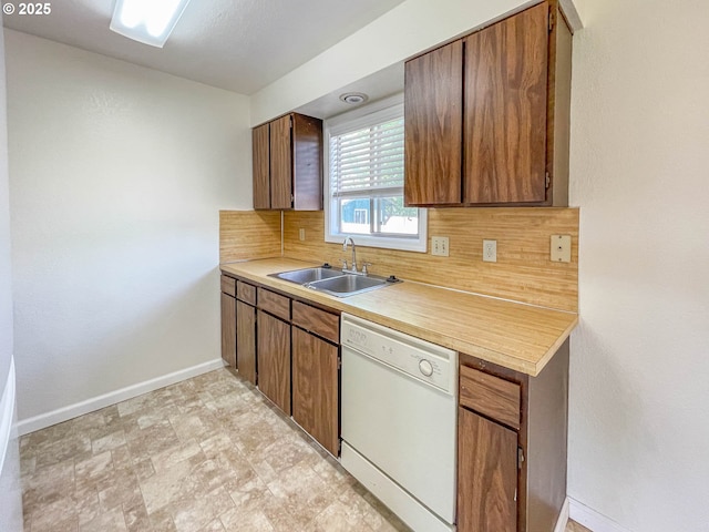 1911 Green Ave, Roseburg, OR 97471 - kitchen with dishwasher, a sink, baseboards, and backsplash
