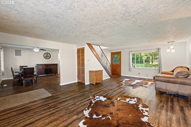 35000 SE Bell Maple Dr, Boring, OR 97009 - living area with a textured ceiling, stairs, baseboards, visible vents, and dark wood-style floors