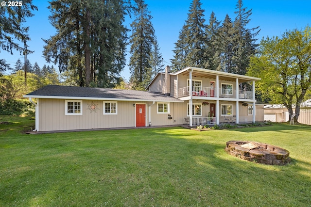35000 SE Bell Maple Dr, Boring, OR 97009 - view of front of home with a front lawn, an outdoor fire pit, a balcony, and a chimney