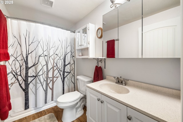 35000 SE Bell Maple Dr, Boring, OR 97009 - bathroom with visible vents, curtained shower, wood finished floors, vanity, and toilet