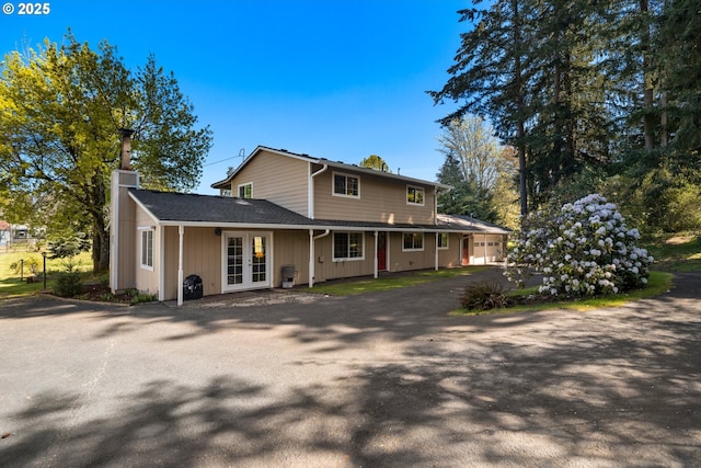 35000 SE Bell Maple Dr, Boring, OR 97009 - view of front of house with a garage, aphalt driveway, french doors, and a chimney
