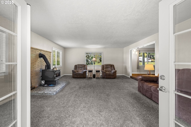 35000 SE Bell Maple Dr, Boring, OR 97009 - living area with plenty of natural light, a wood stove, carpet flooring, and a textured ceiling