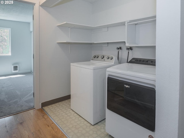 2712 SE 138th Ave Unit 53, Portland, OR 97236 - laundry room featuring washing machine and clothes dryer and baseboards