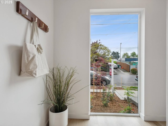 1534 N Schofield St, Portland, OR 97217 - entryway featuring baseboards and wood finished floors