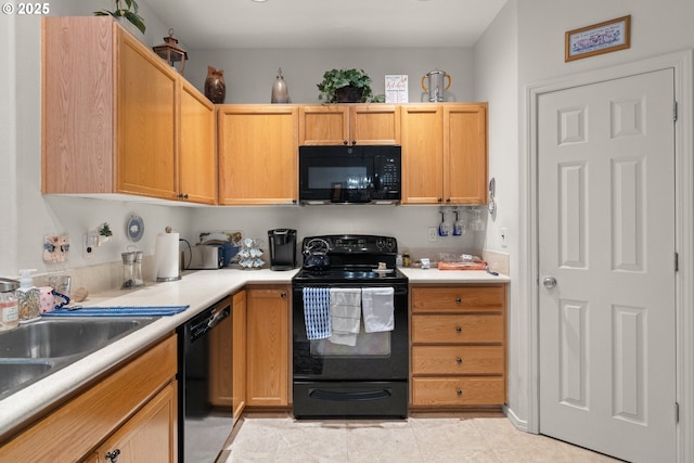 17019 SW Glen Park Ct, Beaverton, OR 97003 - kitchen featuring black appliances, light countertops, a sink, and light tile patterned floors
