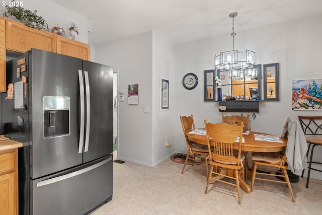 17019 SW Glen Park Ct, Beaverton, OR 97003 - dining area featuring a chandelier, baseboards, and light flooring