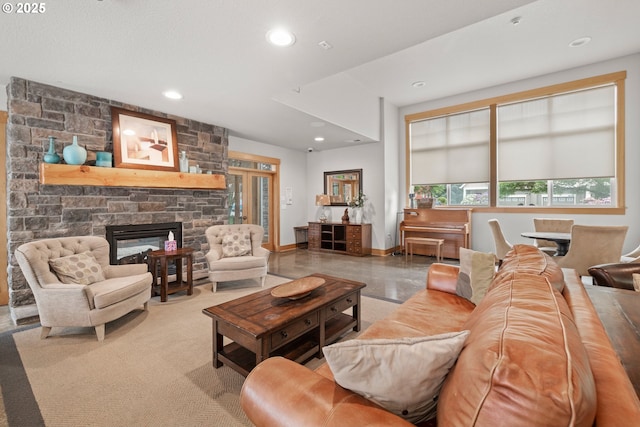 17019 SW Glen Park Ct, Beaverton, OR 97003 - living room with recessed lighting, a stone fireplace, and baseboards