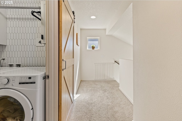 12810 NE 118th Way, Vancouver, WA 98682 - washroom with washer / clothes dryer, radiator, light colored carpet, a barn door, and a textured ceiling