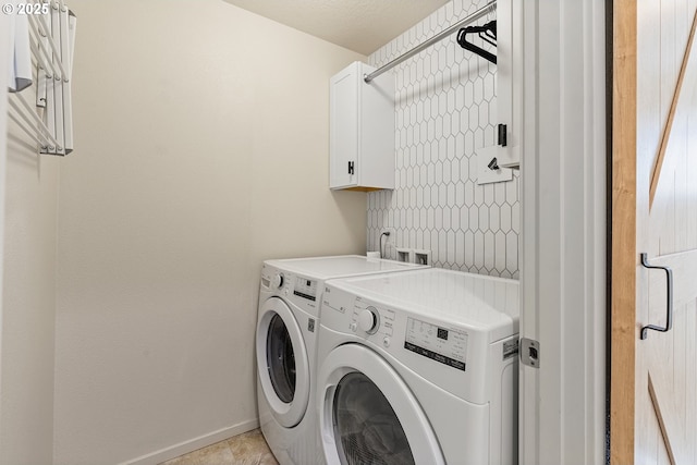 12810 NE 118th Way, Vancouver, WA 98682 - laundry area featuring washer and clothes dryer, cabinet space, and baseboards