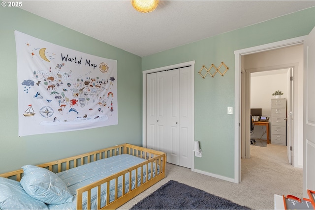 12810 NE 118th Way, Vancouver, WA 98682 - bedroom with carpet floors, a closet, baseboards, and a desk