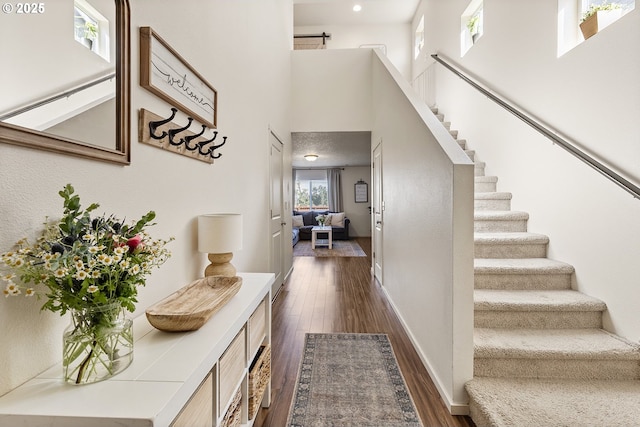 12810 NE 118th Way, Vancouver, WA 98682 - foyer entrance featuring dark wood-style floors, stairs, baseboards, and a high ceiling