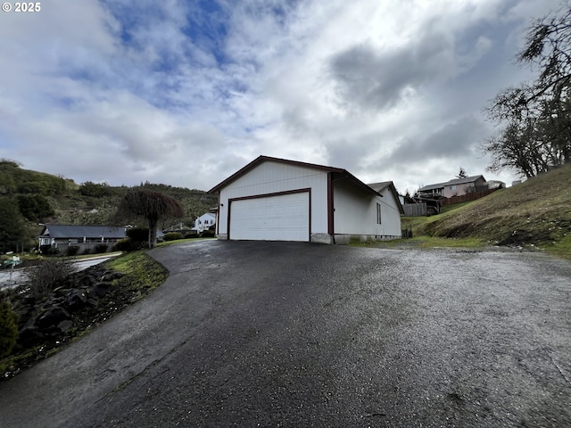 exterior space featuring aphalt driveway