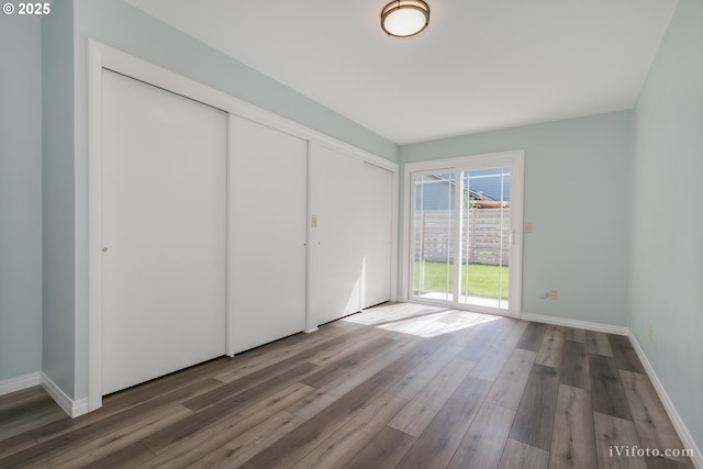 unfurnished bedroom with wood-type flooring