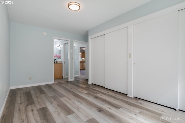 unfurnished bedroom featuring light wood-type flooring