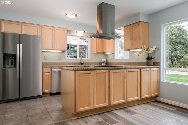 kitchen with plenty of natural light, island exhaust hood, stainless steel appliances, and light brown cabinetry