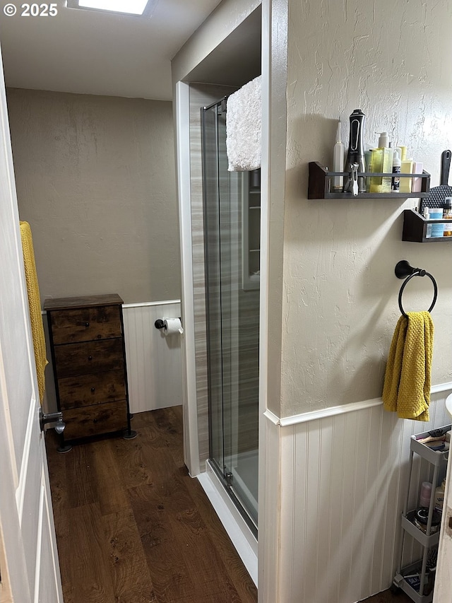 4523 NE 105th Ave, Portland, OR 97220 - full bathroom featuring wood finished floors, a shower stall, and wainscoting