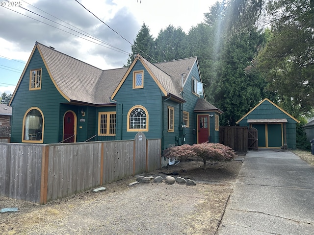 4523 NE 105th Ave, Portland, OR 97220 - view of front facade featuring a shingled roof and concrete driveway