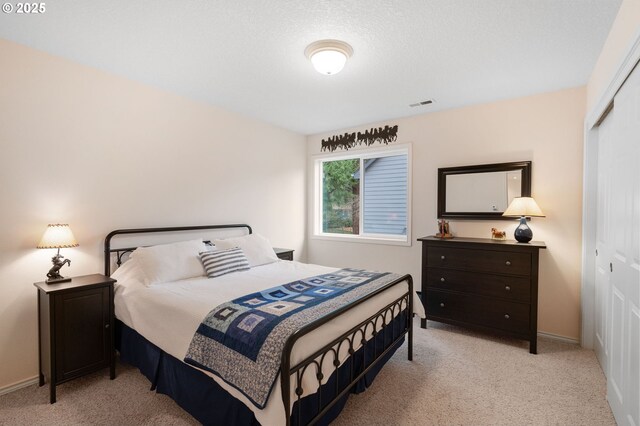 bedroom featuring vaulted ceiling and carpet floors