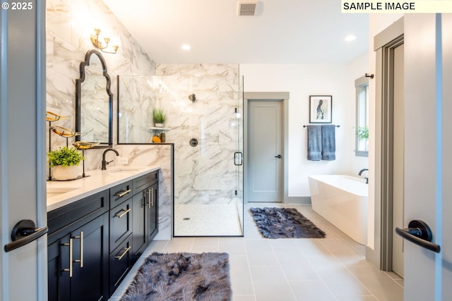 28006 NE 168th Ave, Battle Ground, WA 98604 - full bathroom with double vanity, visible vents, a stall shower, a sink, and a bath