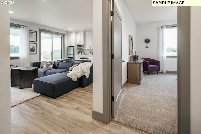 28006 NE 168th Ave, Battle Ground, WA 98604 - hallway with light wood-style floors, plenty of natural light, and baseboards