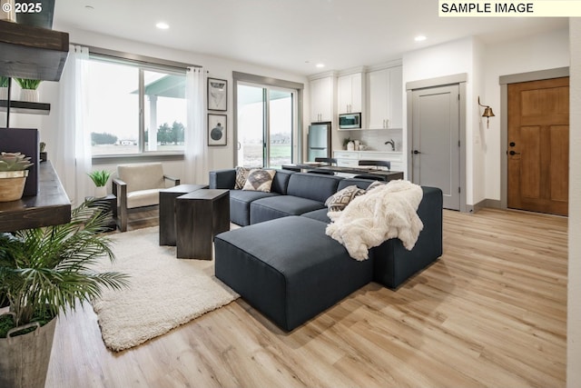 28006 NE 168th Ave, Battle Ground, WA 98604 - living area with light wood-style floors, recessed lighting, and baseboards