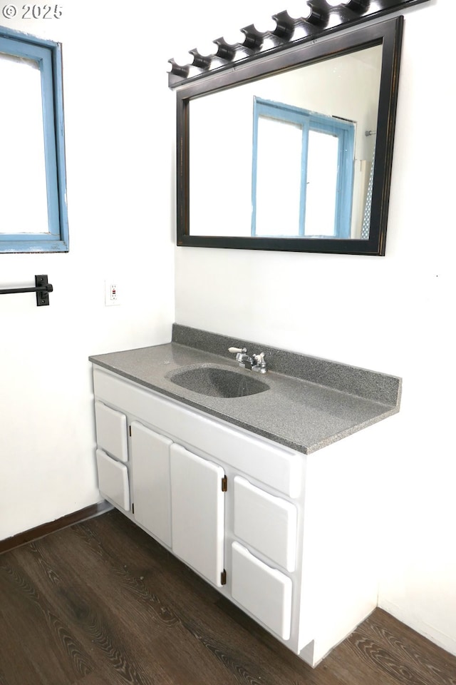 bathroom featuring wood-type flooring and vanity