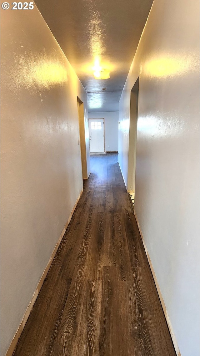 corridor featuring dark hardwood / wood-style flooring