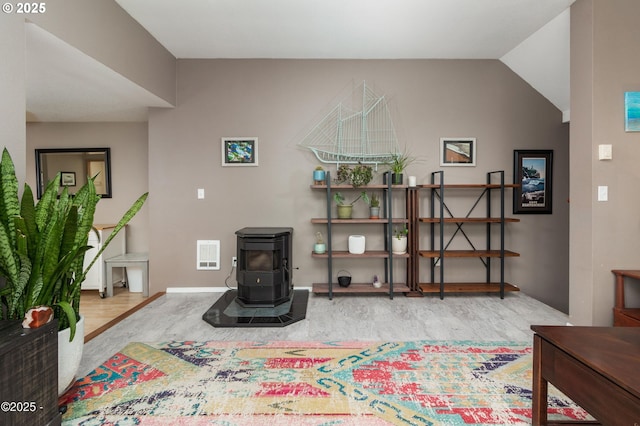 3158 SW Beach Ave, Lincoln City, OR 97367 - living room with a wood stove, wood finished floors, and baseboards