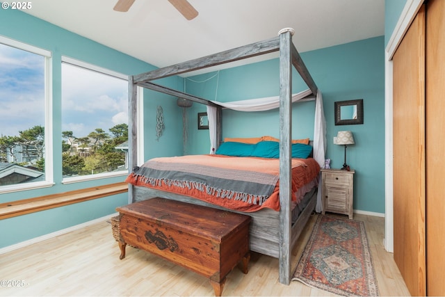3158 SW Beach Ave, Lincoln City, OR 97367 - bedroom featuring wood finished floors, baseboards, and a ceiling fan