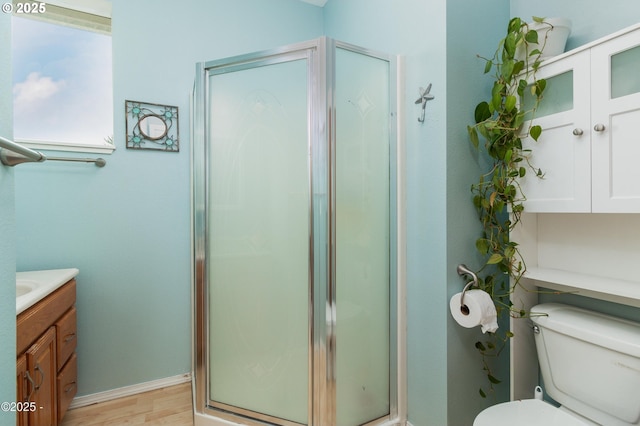 3158 SW Beach Ave, Lincoln City, OR 97367 - full bath featuring a shower stall, wood finished floors, vanity, and toilet