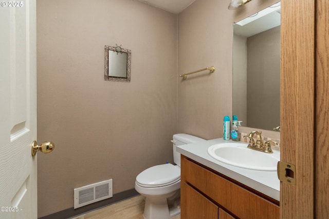 3158 SW Beach Ave, Lincoln City, OR 97367 - bathroom with vanity, toilet, and wood finished floors