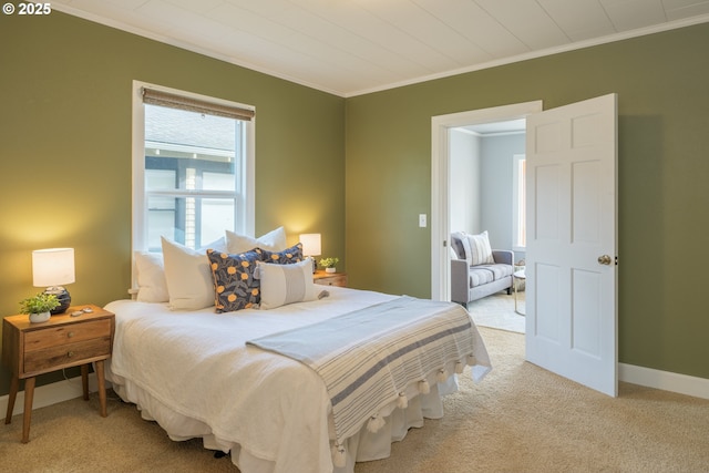 bedroom with light carpet, baseboards, and crown molding