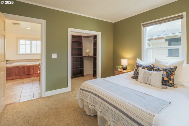 bedroom with crown molding, a closet, visible vents, light colored carpet, and a spacious closet