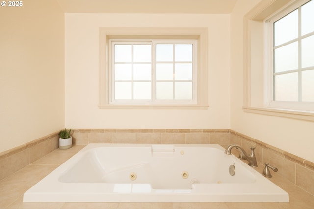 full bath with plenty of natural light and a tub with jets